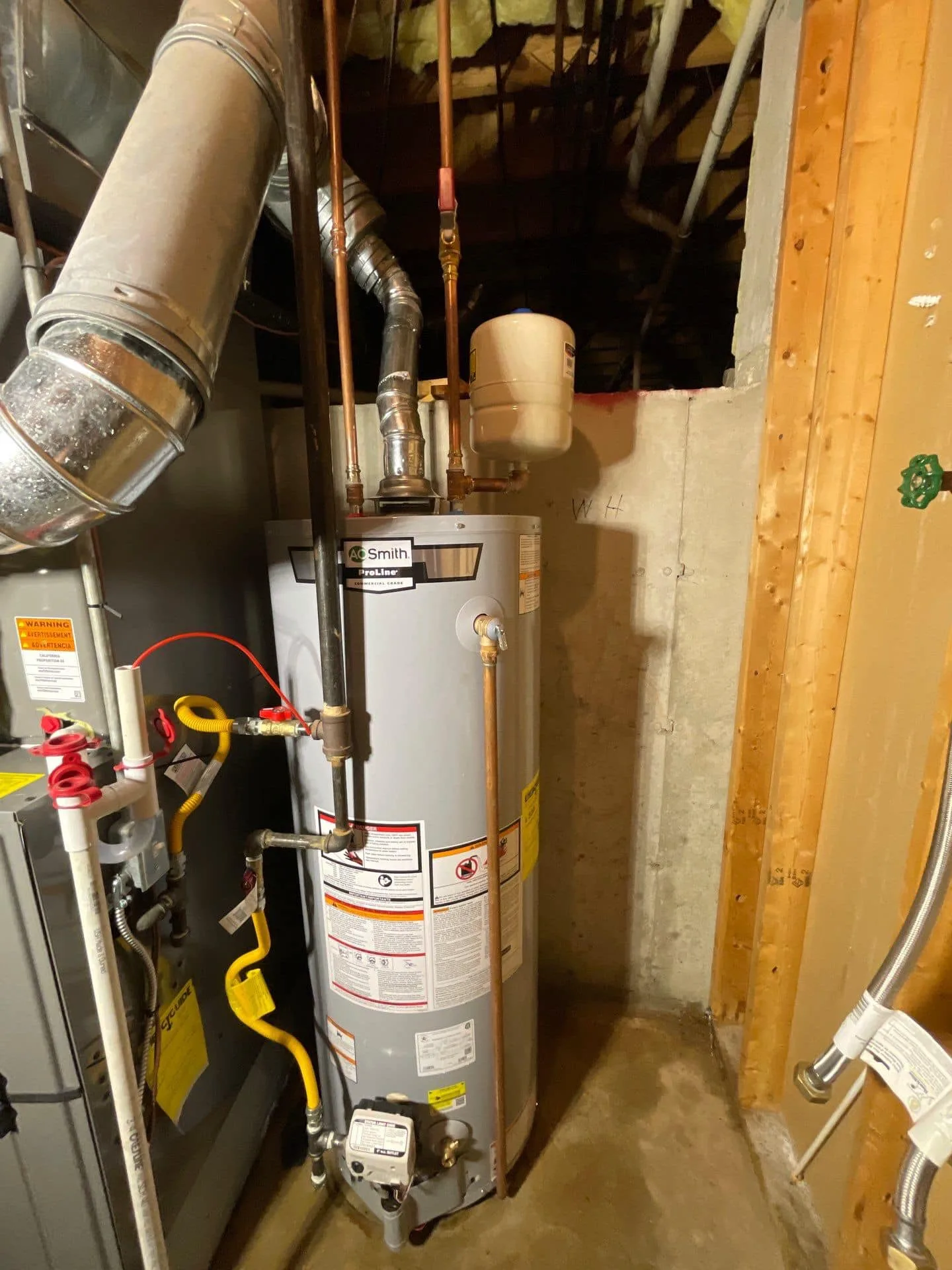 New AO Smith tank water heater installed by Polley's Perfect Seasons in a Plainfield, IN basement