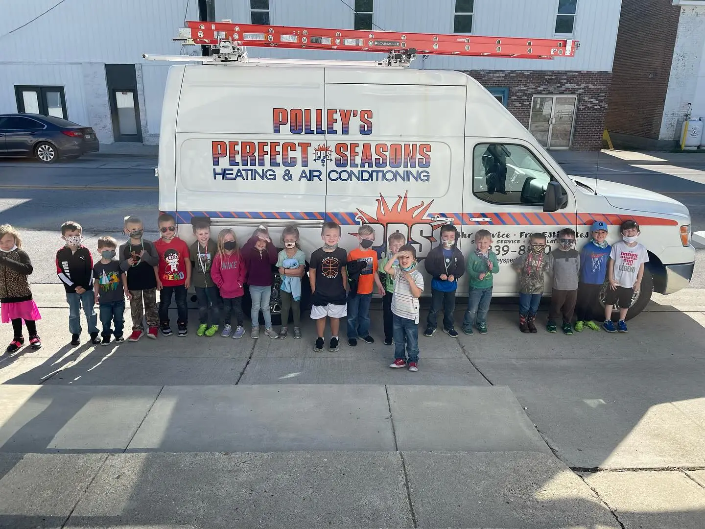 Polley's Perfect Seasons van with local Plainfield schoolkids at a community event