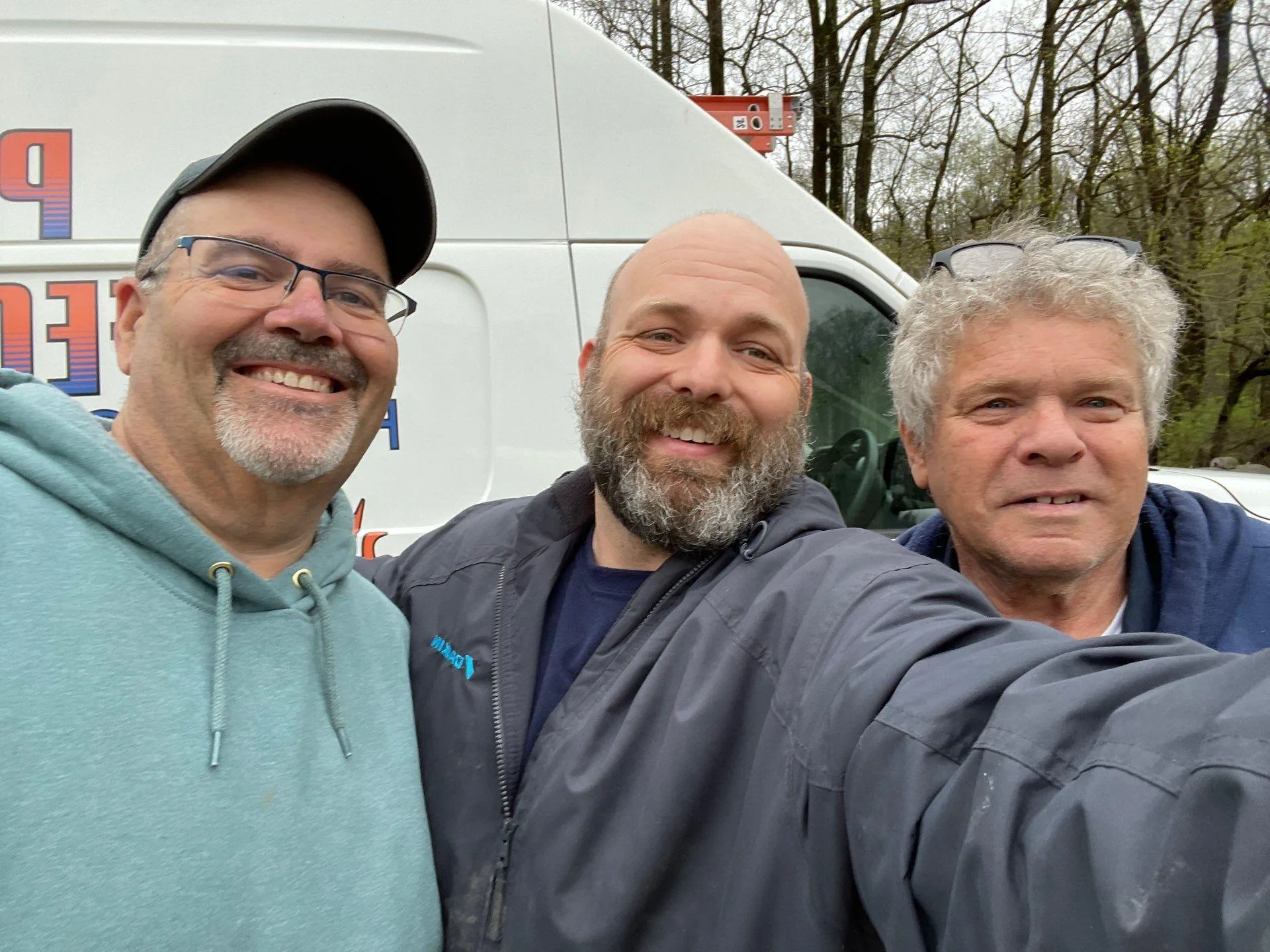 Polley's technicians next to a service van