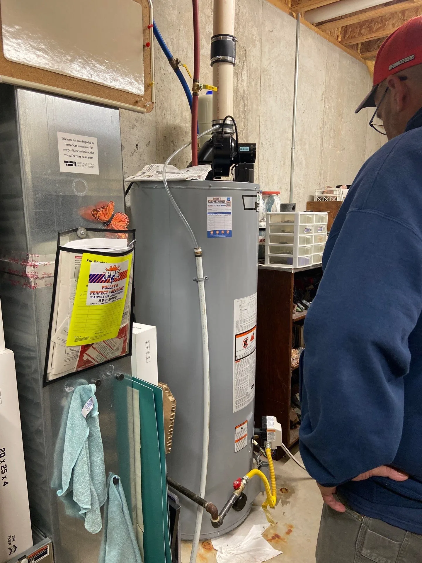 Polley's tech inspecting a new water heater for a Clayton, IN homeowner